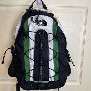 The North Face Black and Green Slingshot Backpack